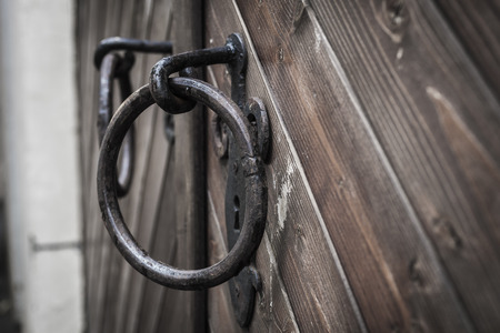 Old Wooden Door Detail With Rusty Ring Doorknobs