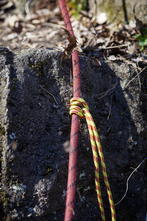 Fragment of climbing rope on rock clouse upの写真素材