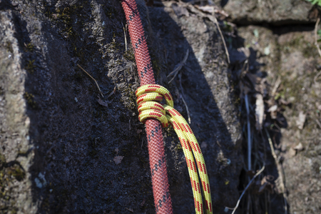 Fragment of climbing rope on rock clouse upの写真素材
