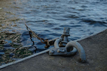 Old vintage marina bollard (bitt) for boats, ships and yachts mooring in marinaの写真素材