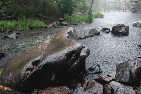 Rain on the river Gorsky Tikich rocky banks near high granite rocks. Buksky canyon, Cherkasy region. Sights and nature of Ukraine.の写真素材