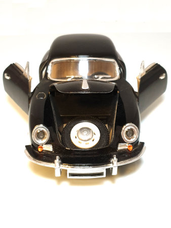 Model of a vintage sports car  with opened doors isolated on the white backgroundの写真素材