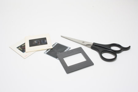Slide film frames and scissors isolated on the white background