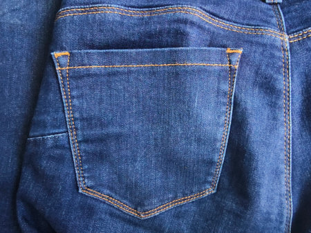 pocket and small pocket in faded blue jeans, blue Jean denim texture background