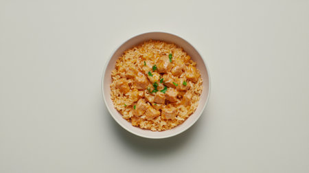 A captivating image of a flavorful chicken stir-fry with rice, highlighted by fresh herbs, showcasing an inviting and healthy dining experience on a simple backdrop.の素材