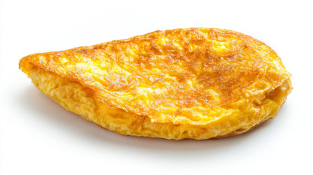 A beautifully cooked omelette showcasing a golden-brown exterior and fluffy texture. Ideal for breakfast, brunch, or gourmet culinary presentations.の素材