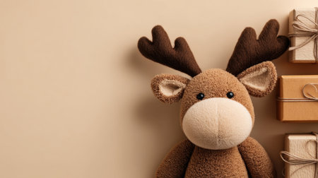 A cheerful plush reindeer toy sits near beautifully wrapped presents against a soft beige background, perfect for capturing the spirit of the holiday season.の素材