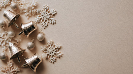 Charming winter decoration featuring silver bells, delicate snowflakes, and ornamental accents on a soft textured background, perfect for holiday projects and celebrations.の素材