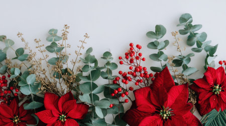 This stunning image features vibrant red poinsettias paired with lush eucalyptus and bright berries, perfect for adding elegance and cheer to holiday decorations and arrangements.の素材