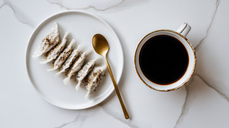 A beautifully arranged plate of delicious dumplings next to a steaming cup of black coffee captures the essence of culinary artistry and lifestyle elegance.の素材