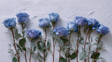 A visually stunning collection of soft blue roses arranged on a textured white background, perfect for decoration ideas, wedding themes, or artistic projects.の素材