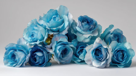 A stunning display of light blue roses, showcasing their delicate petals against a neutral background. Ideal for floral arrangements, celebrations, and artistic projects.の素材