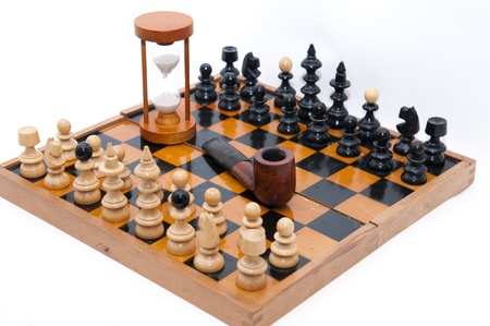 chess figures with sand-glass and smoking pipeの写真素材