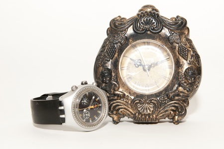 old clock and new watchの写真素材