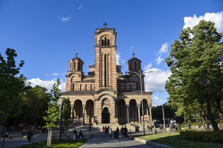 BELGRADE, SERBIA - MAY 10, 2019: Beautiful and stunning Saint Markâs church in Belgrade, Serbia on a sunny spring day and people walking near itのeditorial素材