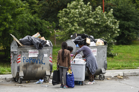 BELGRADE, SERBIA - JUNE 3, 2019:  Poor people family find or searching garbage for sell to reuse and recycle in landfill.のeditorial素材