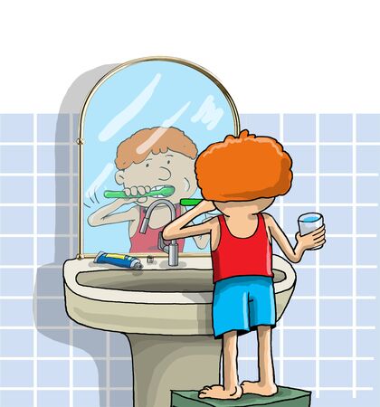 The boy in the bathroom brushes his teethの写真素材