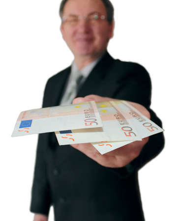 Money in hand of the successful businessman isolated on white.の写真素材