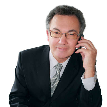 Portrait of successful businessman talking on handphone. Isolated on white.の写真素材
