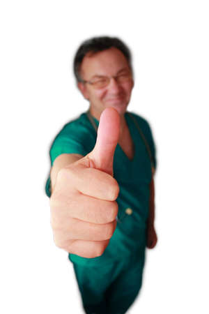 Smiling doctor with thumb up isolated on white.の写真素材
