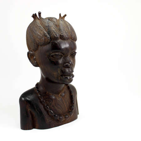 Bust of a Wooden African Woman Isolated on White.の写真素材