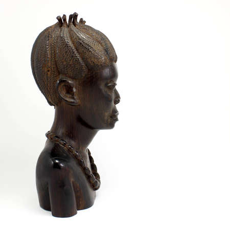 Bust of a Wooden African Woman Isolated on White.の写真素材