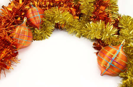 Orange-Yellow Christmas Decorations and Orange-Yellow Tinsel on White Background.の写真素材