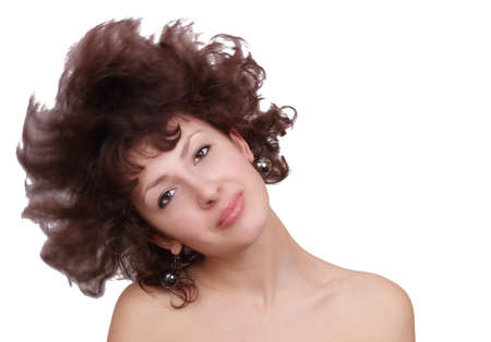 Beautiful attractive young woman with curly hairs isolated on white backgroundの写真素材