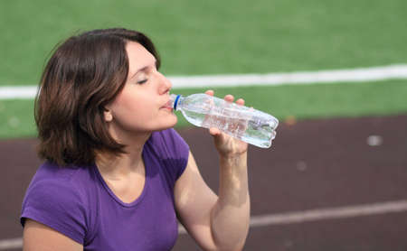 Beautiful Fitness Woman Drinking Waterの写真素材
