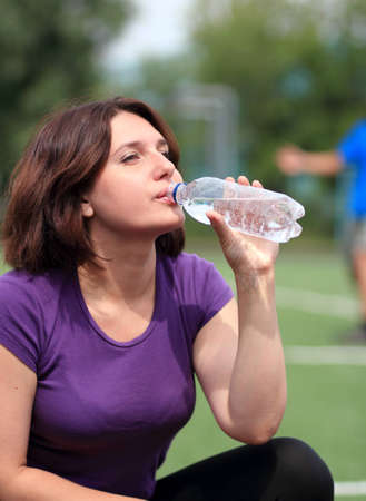 Beautiful Fitness Woman Drinking Waterの写真素材