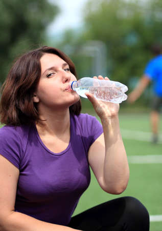 Beautiful Fitness Woman Drinking Waterの写真素材