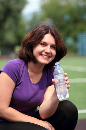 Beautiful Fitness Woman with Bottle of Waterの写真素材