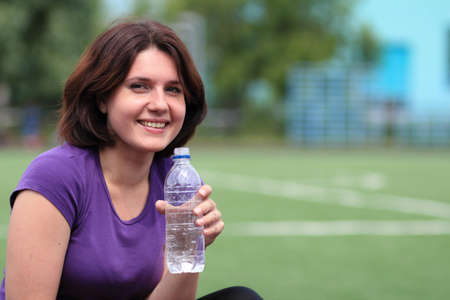 Beautiful Fitness Woman with Bottle of Waterの写真素材
