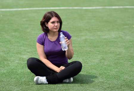 Beautiful Fitness Woman with Bottle of Waterの写真素材