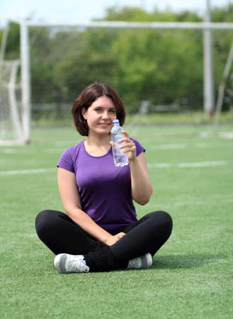 Beautiful Fitness Woman with Bottle of Waterの写真素材
