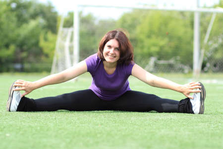 Beautiful Fitness Woman Sitting at Stadiumの写真素材