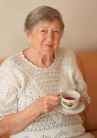 Elderly woman with cup of teaの写真素材