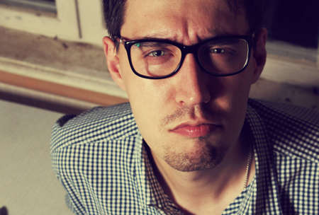 Funny young man wearing glassesの写真素材