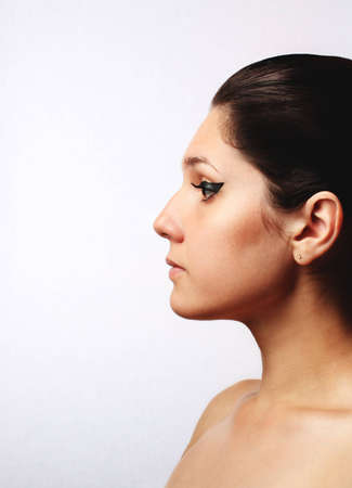 Young beautiful woman in profile with eye make-upの写真素材