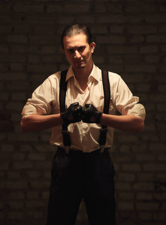 Portrait of young serious mafia man