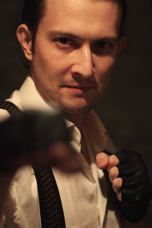 Portrait of young serious mafia manの写真素材