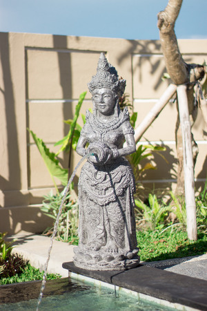 Beautiful fountain with statue of a woman with a water jugの写真素材