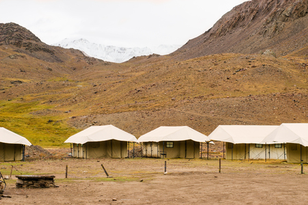 Tourist tents in a trekking camping up in a mountains in Manali Indiaの写真素材