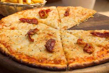 Crispy tasty margherita pizza with cheese and tomatoの写真素材