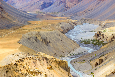 Blue river flowing between beautiful sand dunes in Himalaya mountains. Travel and environment concept.の写真素材