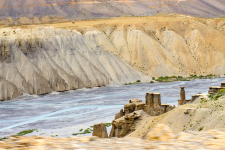 Blue river with sandy rocks on coast. Travel and environment concept.の写真素材