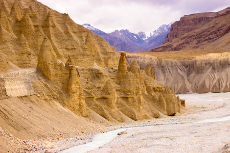 Interesting sandy pyramids in mountain dunes. Strange landscape.の写真素材