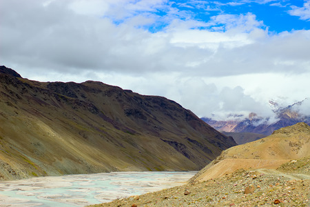 River among the mountains and clouds with blue sky. Trekking concept.の写真素材