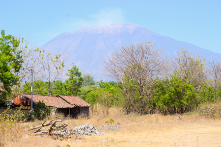 The huge and mighty volcano Agung sleeps peacefully among the Balinese natureの写真素材