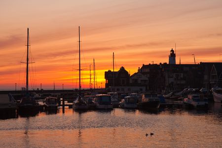 Sunset silhouette of Dutch fishery villageの写真素材